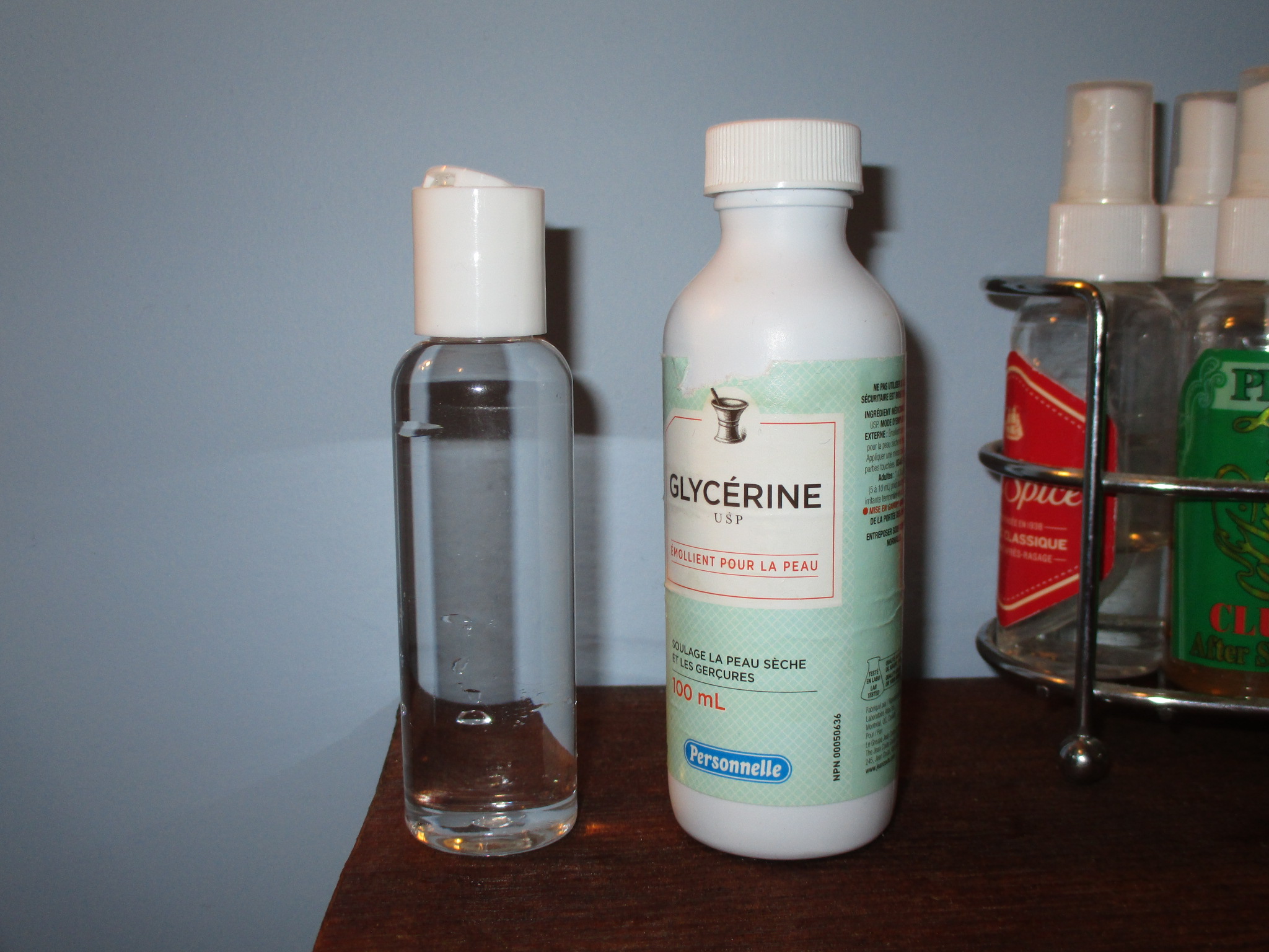 Flip-top plastic bottle for dispensing small amounts of glycerin.
